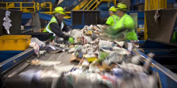 Workers sorting recycling products